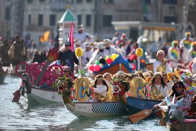 (260202) -- VENICE, Feb. 2, 2026 (Xinhua) -- Revelers dress up in theme of the Olympic Games during the water parade of Venice Carnival in Venice, Italy, Feb. 1, 2026. The 2026 version of the traditional Venice Carnival runs from Jan. 31 to Feb. 17. (Xinhua/Li Jing)