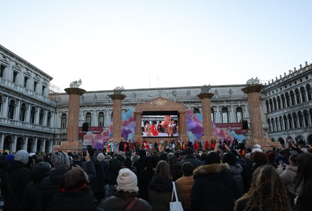 (260202) -- VENICE, Feb. 2, 2026 (Xinhua) -- Artists perform on the main stage of the Venice Carnival which is decorated in theme of the Olympic Games at St. Mark's Square in Venice, Italy, Feb. 1, 2026. The 2026 version of the traditional Venice Carnival runs from Jan. 31 to Feb. 17. (Xinhua/Li Jing)