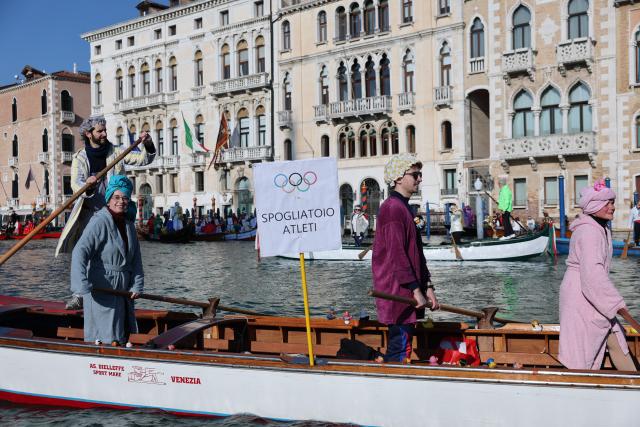 (260202) -- VENICE, Feb. 2, 2026 (Xinhua) -- Revelers dress up in theme of the Olympic Games during the water parade of Venice Carnival in Venice, Italy, Feb. 1, 2026. The 2026 version of the traditional Venice Carnival runs from Jan. 31 to Feb. 17. (Xinhua/Li Jing)