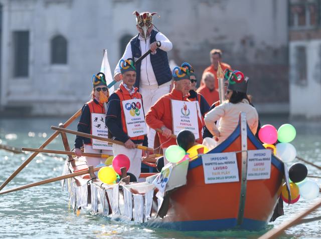 (260202) -- VENICE, Feb. 2, 2026 (Xinhua) -- Revelers dress up in theme of the Olympic Oath during the water parade of Venice Carnival in Venice, Italy, Feb. 1, 2026. The 2026 version of the traditional Venice Carnival runs from Jan. 31 to Feb. 17. (Xinhua/Li Jing)