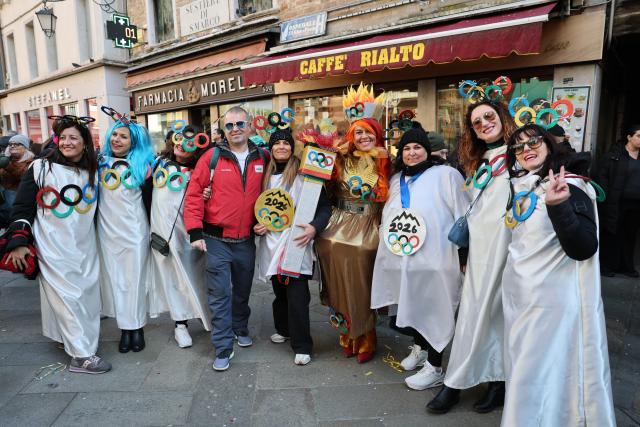 (260202) -- VENICE, Feb. 2, 2026 (Xinhua) -- Revelers dressed up in theme of the Olympic Games pose during the Venice Carnival in Venice, Italy, Feb. 1, 2026. The 2026 version of the traditional Venice Carnival runs from Jan. 31 to Feb. 17. (Xinhua/Li Jing)