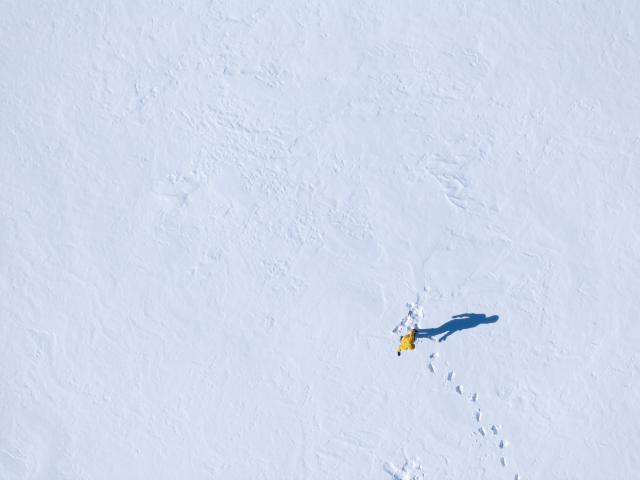 (260202) -- ALMATY, Feb. 2, 2026 (Xinhua) -- A drone photo shows a tourist visiting the Kolsai Lakes National Park in Almaty Region, Kazakhstan, Jan. 31, 2026. (Xinhua/Li Renzi)