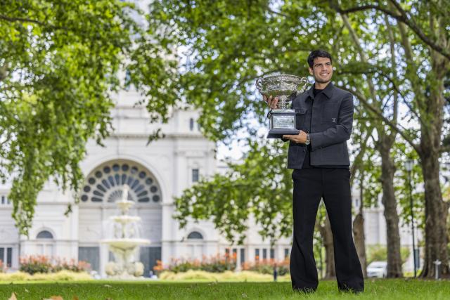 (260202) -- MELBOURNE, Feb. 2, 2026 (Xinhua) -- Carlos Alcaraz of Spain poses with the Norman Brookes Challenge Cup during the 2026 Australian Open men's champion media opportunity at the Royal Exhibition Building in Melbourne, Australia, Feb. 2, 2026. (Photo by Hu Jingchen/Xinhua)