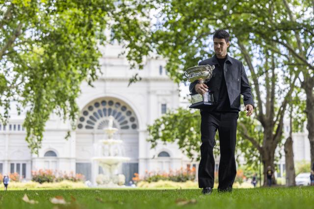 (260202) -- MELBOURNE, Feb. 2, 2026 (Xinhua) -- Carlos Alcaraz of Spain poses with the Norman Brookes Challenge Cup during the 2026 Australian Open men's champion media opportunity at the Royal Exhibition Building in Melbourne, Australia, Feb. 2, 2026. (Photo by Hu Jingchen/Xinhua)