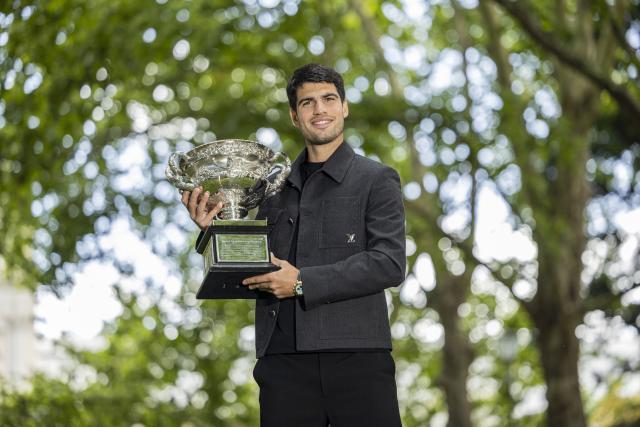 (260202) -- MELBOURNE, Feb. 2, 2026 (Xinhua) -- Carlos Alcaraz of Spain poses with the Norman Brookes Challenge Cup during the 2026 Australian Open men's champion media opportunity at the Royal Exhibition Building in Melbourne, Australia, Feb. 2, 2026. (Photo by Hu Jingchen/Xinhua)