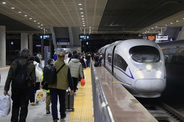 (260202) -- BEIJING, Feb. 2, 2026 (Xinhua) -- Passengers board a train at Shenzhen North Railway Station in Shenzhen, south China's Guangdong Province, Feb. 2, 2026. China ushered in its largest annual population migration on Monday, 15 days ahead of the 2026 Spring Festival, also known as the Chinese New Year.
  A total of 9.5 billion passenger trips are expected during this year's travel rush period that will end on March 13, which will be a historic high.
  Of this total, road trips remain the dominant mode of travel, accounting for approximately 80 percent. 
  An estimated 540 million passenger trips will be handled by the country's railways, while the civil aviation sector will see 95 million trips. Both the overall scale and daily peak traffic of rail and air travel are expected to surpass historic high levels this year.
  In China, the 40-day travel surge will witness hundreds of millions of people return to their hometowns for family reunions. (Xinhua/Mao Siqian)