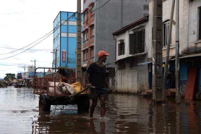 (260202) -- ANTANANARIVO, Feb. 2, 2026 (Xinhua) -- A man pulls a cart on a flooded street in Antananarivo, Madagascar, Feb. 2, 2026. The passage of tropical cyclone Fytia has caused the death of seven people and affected more than 54,000 others in Madagascar, Malagasy authorities said on Monday. (Photo by Sitraka Rajaonarison/Xinhua)