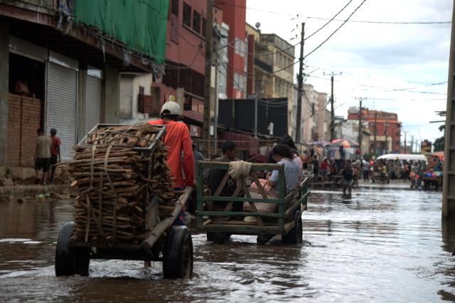 (260202) -- ANTANANARIVO, Feb. 2, 2026 (Xinhua) -- People make their way on a flooded street in Antananarivo, Madagascar, Feb. 2, 2026. The passage of tropical cyclone Fytia has caused the death of seven people and affected more than 54,000 others in Madagascar, Malagasy authorities said on Monday. (Photo by Sitraka Rajaonarison/Xinhua)
