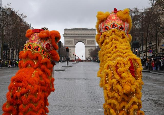 (260202) -- PARIS, Feb. 2, 2026 (Xinhua) -- Artists perform a lion dance during a parade celebrating the upcoming Chinese New Year on the Champs-Elysees avenue in Paris, France, Feb. 1, 2026. (Xinhua/Zhang Baihui)
