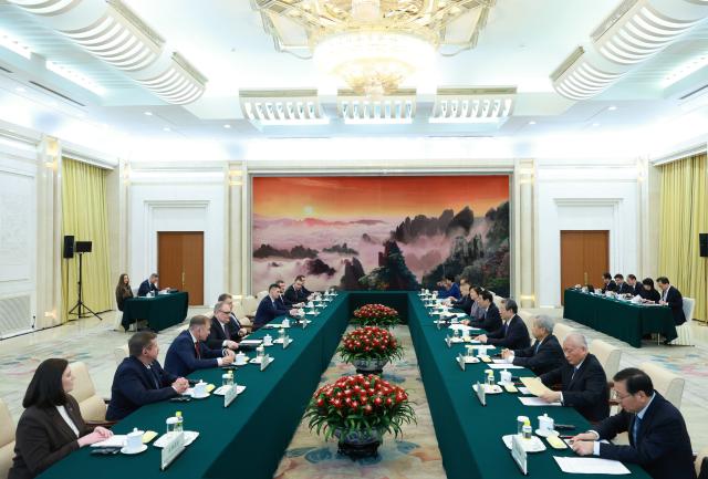 (260202) -- BEIJING, Feb. 2, 2026 (Xinhua) -- Wang Huning, a member of the Standing Committee of the Political Bureau of the Communist Party of China Central Committee and chairman of the Chinese People's Political Consultative Conference National Committee, meets with a delegation from the Liberal Democratic Party of Russia, headed by its chairman Leonid Slutsky, in Beijing, capital of China, Feb. 2, 2026. (Xinhua/Wang Ye)