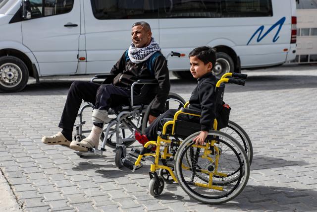 (260202) -- GAZA, Feb. 2, 2026 (Xinhua) -- Palestinian patients wait outside the Palestinian Red Crescent building in Khan Younis, southern Gaza Strip, as they prepare to cross through the Rafah border crossing for medical treatment, on Feb. 2, 2026. Some Palestinian patients started moving from the city of Khan Younis toward the Rafah land crossing in southern Gaza, in preparation for their travel abroad, Palestinian medical sources said Monday.
   Earlier on Monday, the crossing, the only channel linking Gaza with Egypt, was reopened in both directions on a limited and trial basis, as a number of Palestinians arrived on the Egyptian side of the crossing in preparation for entering Gaza, according to Palestinian sources. (Photo by Rizek Abdeljawad/Xinhua)