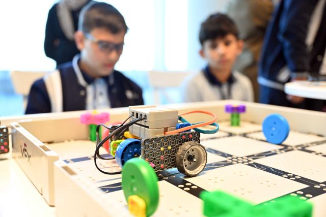 (260202) -- HAWALLI GOVERNORATE, Feb. 2, 2026 (Xinhua) -- Students showcase their invention during the exhibition in Hawalli Governorate, Kuwait, Feb. 2, 2026. An one-day educational technology exhibition was held on Monday, highlighting Kuwait's commitment to advancing education by promoting innovation, digital transformation, and the effective integration of technology into teaching and learning. (Photo by Asad/Xinhua)