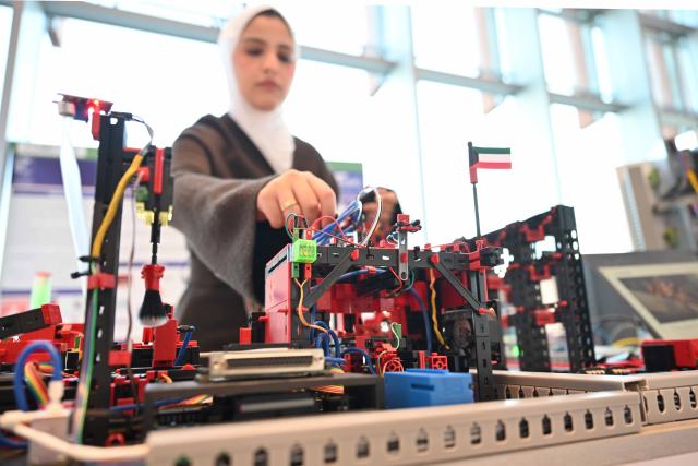 (260202) -- HAWALLI GOVERNORATE, Feb. 2, 2026 (Xinhua) -- A student showcases her invention during the exhibition in Hawalli Governorate, Kuwait, Feb. 2, 2026. An one-day educational technology exhibition was held on Monday, highlighting Kuwait's commitment to advancing education by promoting innovation, digital transformation, and the effective integration of technology into teaching and learning. (Photo by Asad/Xinhua)