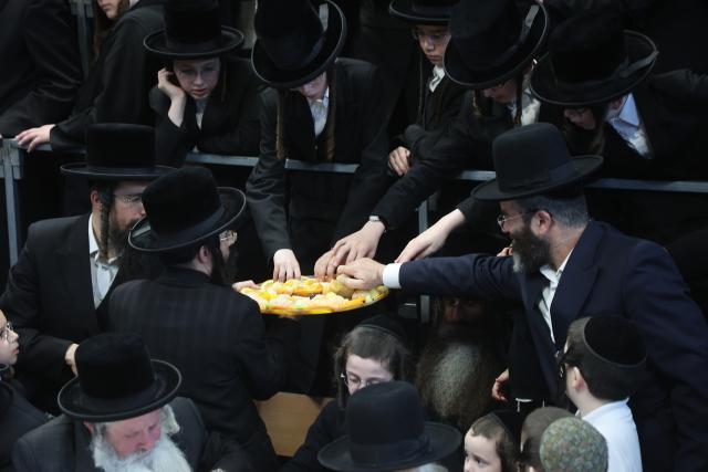 (260202) -- REHOVOT, Feb. 2, 2026 (Xinhua) -- Ultra-Orthodox Jews celebrate the traditional Jewish holiday "Tu Bishvat", or "New Year of the Trees", with a feast of fruits and nuts in the Israeli city of Rehovot near Tel Aviv, Feb. 2, 2026. (Photo by Gil Cohen Magen/Xinhua)