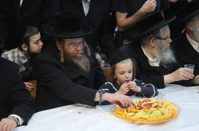 (260202) -- REHOVOT, Feb. 2, 2026 (Xinhua) -- Ultra-Orthodox Jews celebrate the traditional Jewish holiday "Tu Bishvat", or "New Year of the Trees", with a feast of fruits and nuts in the Israeli city of Rehovot near Tel Aviv, Feb. 2, 2026. (Photo by Gil Cohen Magen/Xinhua)