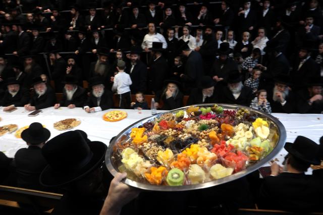 (260202) -- REHOVOT, Feb. 2, 2026 (Xinhua) -- Ultra-Orthodox Jews celebrate the traditional Jewish holiday "Tu Bishvat", or "New Year of the Trees", with a feast of fruits and nuts in the Israeli city of Rehovot near Tel Aviv, Feb. 2, 2026. (Photo by Gil Cohen Magen/Xinhua)