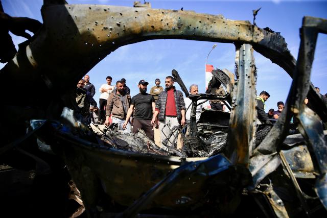 (260203) -- ANSARIYAH, Feb. 3, 2026 (Xinhua) -- People are seen around the wreckage of a car targeted by an Israeli drone in Ansariyah, southern Lebanon, Feb. 2, 2026. One person was killed and eight others were injured on Monday in two Israeli airstrikes on southern Lebanon, the Lebanese health ministry reported.
   According to the ministry, one person was killed and four others were injured in an Israeli airstrike on a vehicle in Ansariyah area, whereas four more were injured in an Israeli airstrike on a car in the Tyre district. (Photo by Ali Hashisho/Xinhua)