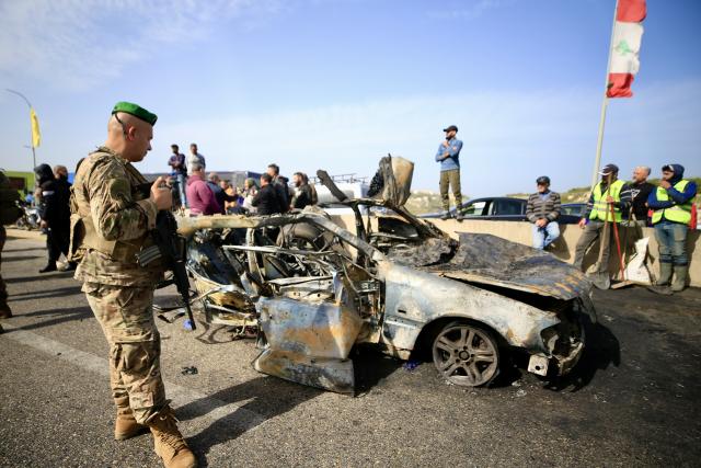 (260203) -- ANSARIYAH, Feb. 3, 2026 (Xinhua) -- This photo taken on Feb. 2, 2026 shows people around the wreckage of a car targeted by an Israeli drone in Ansariyah, southern Lebanon. One person was killed and eight others were injured on Monday in two Israeli airstrikes on southern Lebanon, the Lebanese health ministry reported.
   According to the ministry, one person was killed and four others were injured in an Israeli airstrike on a vehicle in Ansariyah area, whereas four more were injured in an Israeli airstrike on a car in the Tyre district. (Photo by Ali Hashisho/Xinhua)