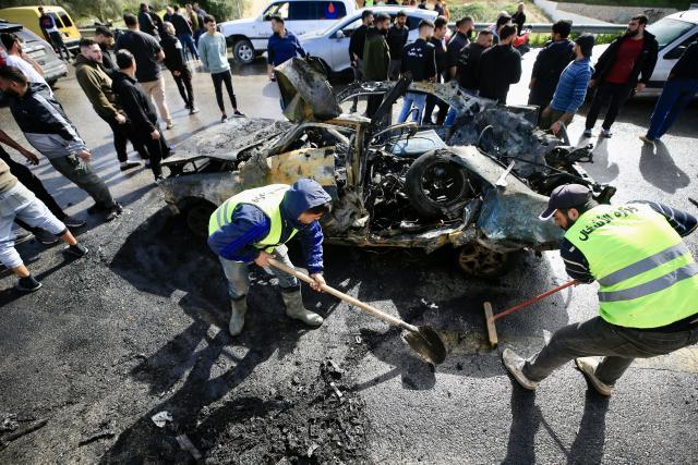 (260203) -- ANSARIYAH, Feb. 3, 2026 (Xinhua) -- People clean the wreckage of a car targeted by an Israeli drone in Ansariyah, southern Lebanon, Feb. 2, 2026. One person was killed and eight others were injured on Monday in two Israeli airstrikes on southern Lebanon, the Lebanese health ministry reported.
   According to the ministry, one person was killed and four others were injured in an Israeli airstrike on a vehicle in Ansariyah area, whereas four more were injured in an Israeli airstrike on a car in the Tyre district. (Photo by Ali Hashisho/Xinhua)