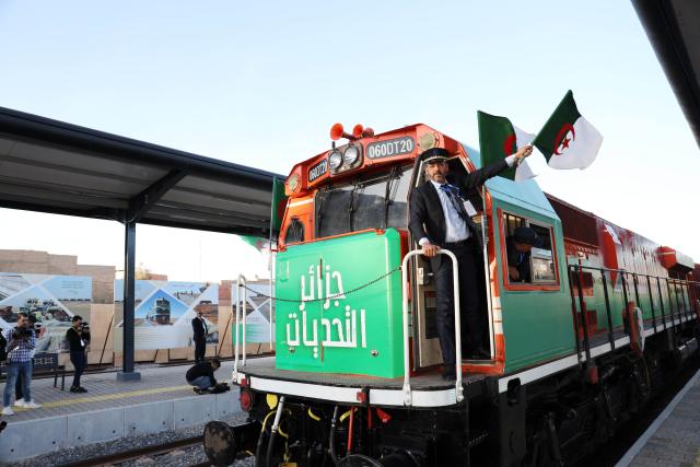 (260203) -- BECHAR, Feb. 3, 2026 (Xinhua) -- A train stands at a station platform during a ceremony for the open of the Western Mining Railway in Bechar province, Algeria, Feb. 1, 2026. Algeria's Western Mining Railway, Africa's first heavy-haul desert railway, has opened to traffic, improving Algeria's national railway network and promoting connectivity and economic development in the country's southwestern areas. The 950-km railway, with 575 km constructed by China Railway Construction Corporation and Algerian state-owned companies, represents the largest infrastructure project undertaken by a Chinese company in Algeria. (Xinhua)