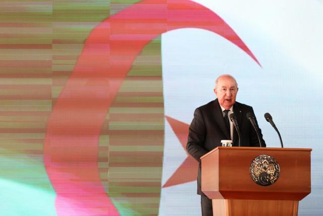 (260203) -- BECHAR, Feb. 3, 2026 (Xinhua) -- Algerian President Abdelmadjid Tebboune announces the official operation of the Western Mining Railway during a ceremony in Bechar province, Algeria, Feb. 1, 2026. Algeria's Western Mining Railway, Africa's first heavy-haul desert railway, has opened to traffic, improving Algeria's national railway network and promoting connectivity and economic development in the country's southwestern areas. The 950-km railway, with 575 km constructed by China Railway Construction Corporation and Algerian state-owned companies, represents the largest infrastructure project undertaken by a Chinese company in Algeria. (Xinhua)