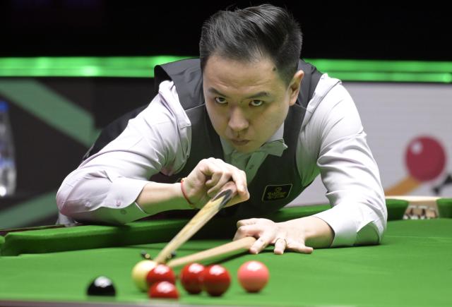 (260203) -- HONG KONG, Feb. 3, 2026 (Xinhua) -- Xiao Guodong of China competes during the first round match against Kyren Wilson of England at the Snooker World Grand Prix 2026 in Hong Kong, south China, Feb. 3, 2026. (Xinhua/Lo Ping Fai)