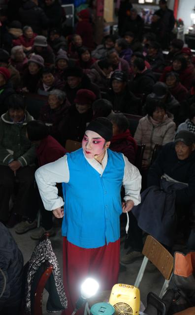 (260203) -- HANGZHOU, Feb. 3, 2026 (Xinhua) -- An artist prepares to perform Wuju Opera in Wucun Village, Wucheng District of Jinhua City, east China's Zhejiang Province, Jan. 27, 2026.
  Around the Spring Festival, opera troupes are busy performing in the countryside of Zhejiang, creating a vibrant and festive atmosphere. (Xinhua/Weng Xinyang)