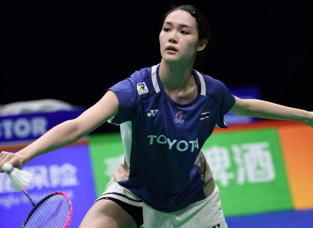 (260203) -- QINGDAO, Feb. 3, 2026 (Xinhua) -- Pitchamon Opatniputh of Thailand hits a return in the women's singles match against Eaint Chit Phoo of Myanmar during the Group Y match between Thailand and Myanmar at Badminton Asia Team Championships 2026 in Qingdao, east China's Shandong Province, Feb. 3, 2026. (Xinhua/Li Ziheng)