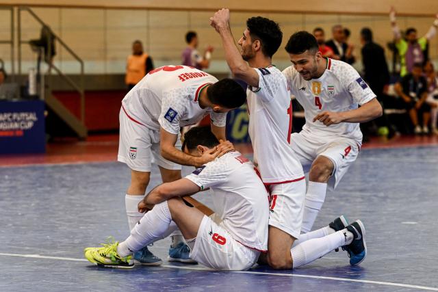 (260203) -- JAKARTA, Feb. 3, 2026 (Xinhua) -- Players of Iran celebrate after scoring during the quarterfinal match between Iran and Uzbekistan at the AFC Futsal Asian Cup 2026 in Jakarta, Indonesia, Feb. 3, 2026. (Xinhua/Agung Kuncahya B.)