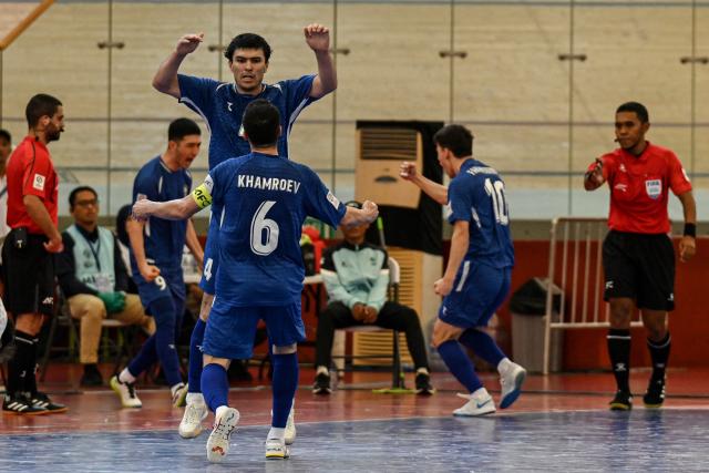 (260203) -- JAKARTA, Feb. 3, 2026 (Xinhua) -- Players of Uzbekistan celebrate after scoring during the quarterfinal match between Iran and Uzbekistan at the AFC Futsal Asian Cup 2026 in Jakarta, Indonesia, Feb. 3, 2026. (Xinhua/Agung Kuncahya B.)