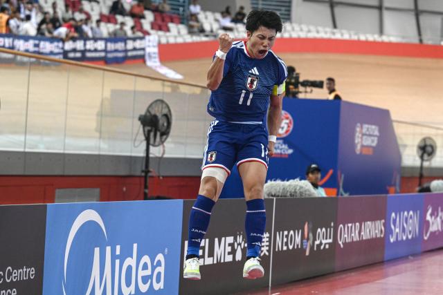 (260203) -- JAKARTA, Feb. 3, 2026 (Xinhua) -- Shimizu Kazuya of Japan celebrates scoring during the quarterfinal match between Japan and Afghanistan at the AFC Futsal Asian Cup 2026 in Jakarta, Indonesia, Feb. 3, 2026. (Xinhua/Agung Kuncahya B.)