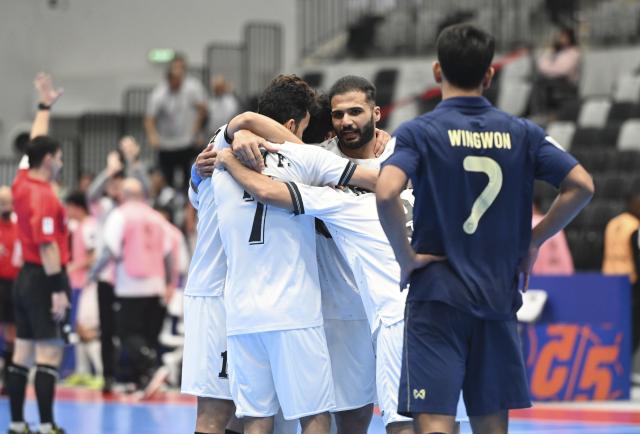 (260203) -- JAKARTA, Feb. 3, 2026 (Xinhua) -- Mustafa Ihsan Al-Bayati (R) of Iraq celebrates his goal with his teammates during the quarterfinal match between Thailand and Iraq at the AFC Futsal Asian Cup 2026 in Jakarta, Indonesia, Feb. 3, 2026. (Xinhua/Zulkarnain)