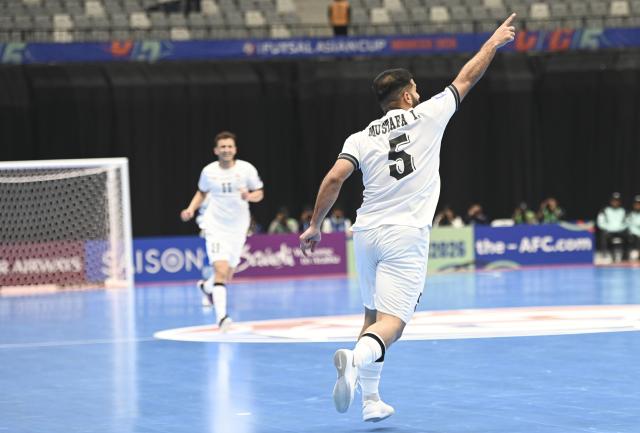 (260203) -- JAKARTA, Feb. 3, 2026 (Xinhua) -- Mustafa Ihsan Al-Bayati (R) of Iraq celebrates his goal during the quarterfinal match between Thailand and Iraq at the AFC Futsal Asian Cup 2026 in Jakarta, Indonesia, Feb. 3, 2026. (Xinhua/Zulkarnain)