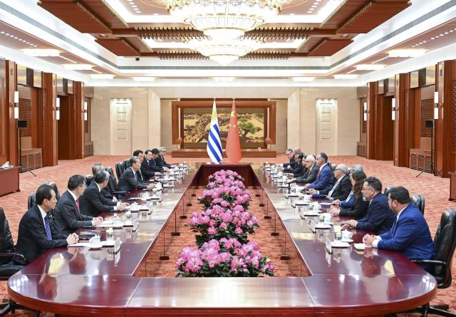 (260203) -- BEIJING, Feb. 3, 2026 (Xinhua) -- Zhao Leji, chairman of the National People's Congress Standing Committee, meets with President of the Oriental Republic of Uruguay Yamandu Orsi in Beijing, capital of China, Feb. 3, 2026. (Xinhua/Zhang Ling)