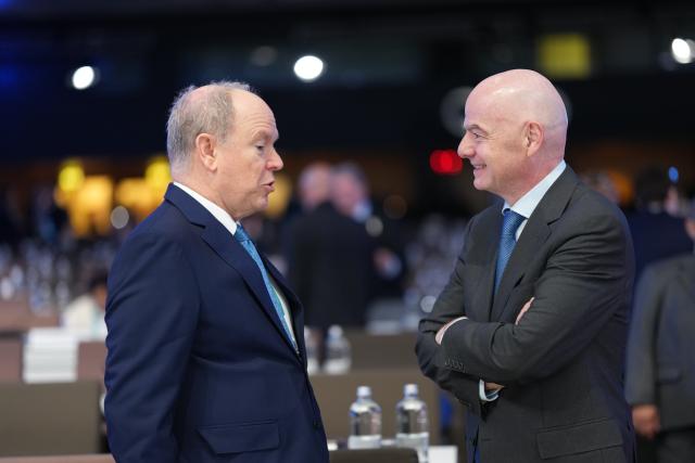 (260203) -- MILAN, Feb. 3, 2026 (Xinhua) -- Prince's Albert II (L) of Monaco speaks with FIFA President Gianni Infantino during the first day of the 145th IOC Session in Milan, Italy, Feb. 3, 2026. (Xinhua/Sun Fei)