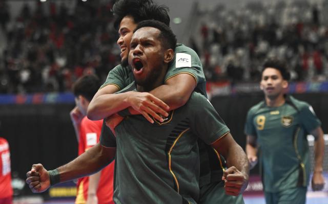 (260203) -- JAKARTA, Feb. 3, 2026 (Xinhua) -- Wendy Brian Lindrey (front) of Indonesia celebrates his goal during the quarterfinal match between Indonesia and Vietnam at the AFC Futsal Asian Cup 2026 in Jakarta, Indonesia, Feb. 3, 2026. (Xinhua/Zulkarnain)