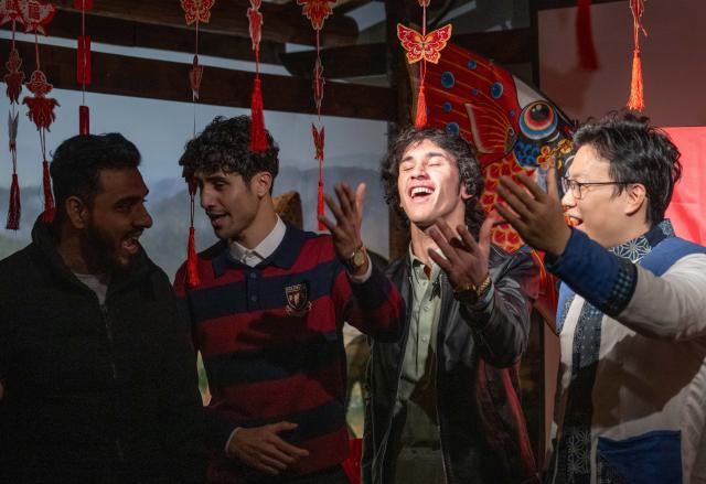 (260203) -- CHONGQING, Feb. 3, 2026 (Xinhua) -- Foreign students experience Mudong folk songs under the instruction of an intangible heritage inheritor (1st R) during an event held in Banan District of Chongqing Municipality, southwest China, Feb. 3, 2026. As the Spring Festival approaches, Banan District of Chongqing Municipality hosted a "Laowai@Chongqing" event. "Laowai" is a Chinese slang term meaning "foreigners".
   Twenty international students gathered to engage in an immersive experience of local traditional cultural practices such as Mudong folk songs, paper cutting, and glutinous rice cake making, embracing the festive atmosphere of the Chinese New Year, which falls on Feb. 17 this year. (Xinhua/Chen Cheng)