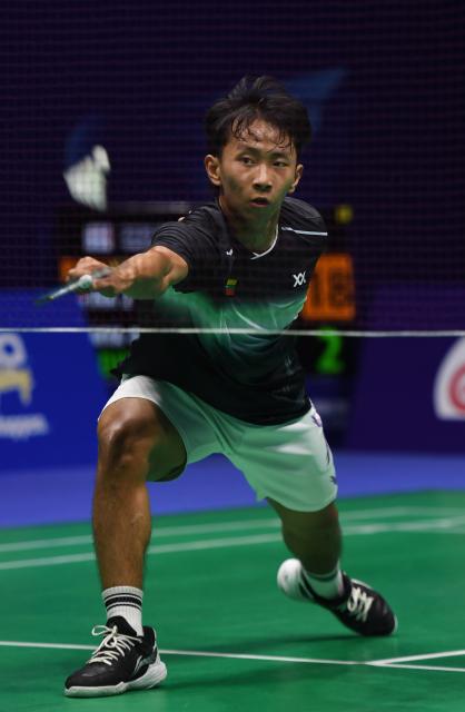 (260203) -- QINGDAO, Feb. 3, 2026 (Xinhua) -- Lal Zuidika of Myanmar hits a return during the men's singles match against Richie Duta Richardo of Indonesia during the men's team group D match between Indonesia and Myanmar at Badminton Asia Team Championships 2026 in Qingdao, east China's Shandong Province, Feb. 3, 2026. (Xinhua/Li Ziheng)
