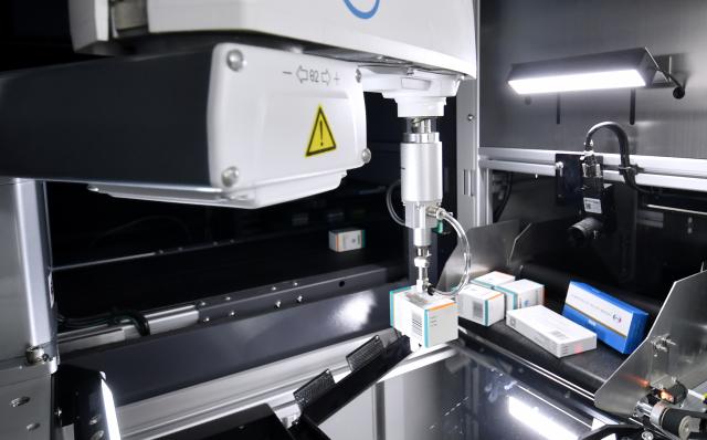 (260203) -- BEIJING, Feb. 3, 2026 (Xinhua) -- A medication sorting robot operates in the pharmacy of the Tongzhou branch of Beijing Anzhen Hospital in Beijing, capital of China, Feb. 3, 2026. Beijing Anzhen Hospital, designated by the Beijing municipal government as the city's first demonstration unit for "robots plus medical" applications, currently has 25 types of medical robots undergoing clinical trials. 
   These robots are deployed across various departments including outpatient clinics, pharmacies, wards, operating rooms, and catheterization rooms. 
   Serving as intelligent assistants to doctors, these robotic "staff members" are becoming a driving force in the hospital's smart transformation and upgrade. (Xinhua/Li Xin)