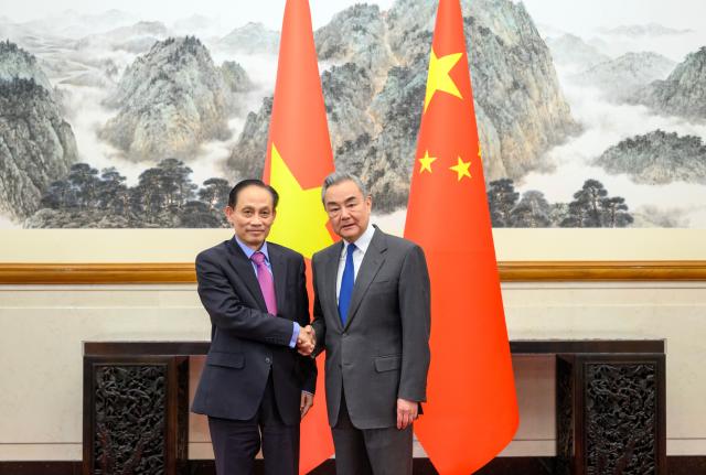(260203) -- BEIJING, Feb. 3, 2026 (Xinhua) -- Chinese Foreign Minister Wang Yi, also a member of the Political Bureau of the Communist Party of China Central Committee, meets with Le Hoai Trung, special envoy of General Secretary of the Communist Party of Vietnam (CPV) Central Committee To Lam, also a member of the Political Bureau of the CPV Central Committee and minister of foreign affairs of Vietnam, in Beijing, capital of China, Feb. 3, 2026. (Xinhua/Jin Liangkuai)