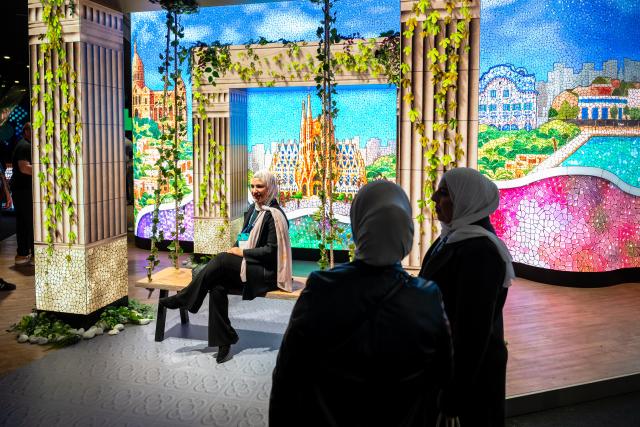 (260203) -- BARCELONA, Feb. 3, 2026 (Xinhua) -- A visitor poses for photos during the Integrated Systems Europe 2026 in Barcelona, Spain, Feb. 3, 2026. (Photo by Joan Gosa/Xinhua)