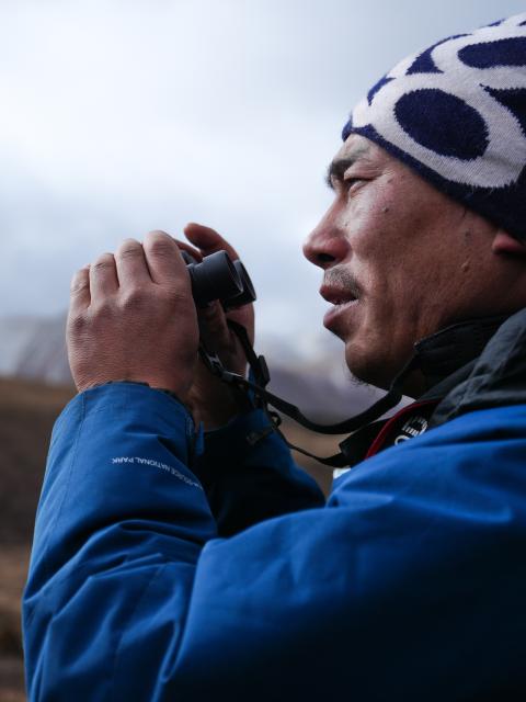 (260203) -- YUSHU, Feb. 3, 2026 (Xinhua) -- Tseten patrols in Angsai Township of Zaduo County, Yushu Tibetan Autonomous Prefecture, northwest China's Qinghai Province, Jan. 29, 2026. Amid snow-capped mountains and deep valleys in Angsai Township of Zaduo County, an area in Sanjiangyuan National Park, Tseten and Kunga trek over ridges, cross alpine meadows and carry out ecological patrols, pressing the shutter as they move through the landscape.    
   In 2016, Tseten and Kunga became rangers under a public welfare program. Having taught themselves photography, they have been documenting the mountains, rivers and wildlife of their homeland with their cameras while patrolling, collecting litter, monitoring water sources and observing vegetation. 
   Over a decade, their footprints have spread across the grasslands and river shores. Their lens have remained fixed on the changes unfolding on this land: wildlife populations are increasing, traces of garbage on the grasslands have largely disappeared, and the ecological landscape along the Lancang River has grown better and better. (Xinhua/Qi Zhiyue)