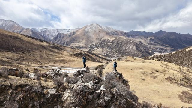 (260203) -- YUSHU, Feb. 3, 2026 (Xinhua) -- A drone photo shows Tseten (R) and Kunga patrolling in Angsai Township of Zaduo County, Yushu Tibetan Autonomous Prefecture, northwest China's Qinghai Province, Jan. 29, 2026. Amid snow-capped mountains and deep valleys in Angsai Township of Zaduo County, an area in Sanjiangyuan National Park, Tseten and Kunga trek over ridges, cross alpine meadows and carry out ecological patrols, pressing the shutter as they move through the landscape.    
   In 2016, Tseten and Kunga became rangers under a public welfare program. Having taught themselves photography, they have been documenting the mountains, rivers and wildlife of their homeland with their cameras while patrolling, collecting litter, monitoring water sources and observing vegetation. 
   Over a decade, their footprints have spread across the grasslands and river shores. Their lens have remained fixed on the changes unfolding on this land: wildlife populations are increasing, traces of garbage on the grasslands have largely disappeared, and the ecological landscape along the Lancang River has grown better and better. (Xinhua/Zhang Long)