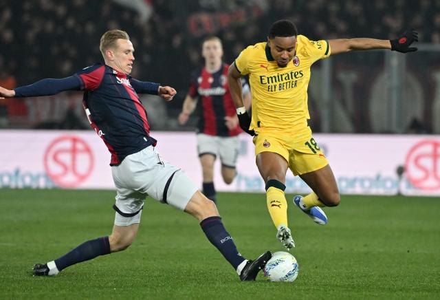 (260204) -- BOLOGNA, Feb. 4, 2026 (Xinhua) -- AC Milan's Christopher Nkunku (R) vies with Bologna's Torbjorn Heggem during a Serie A football match between Bologna and AC Milan in Bologna, Italy, Feb. 3, 2026. (Photo by Alberto Lingria/Xinhua)