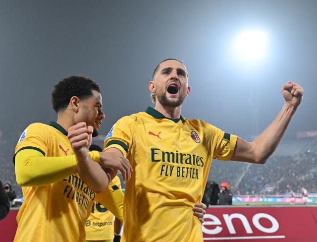 (260204) -- BOLOGNA, Feb. 4, 2026 (Xinhua) -- AC Milan's Adrien Rabiot (R) celebrates his goal with his teammate Zachary Athekame during a Serie A football match between Bologna and AC Milan in Bologna, Italy, Feb. 3, 2026. (Photo by Alberto Lingria/Xinhua)