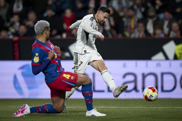 (260204) -- ALBACETE, Feb. 4, 2026 (Xinhua) -- Ronald Araujo of Barcelona vies with Antonio Puertas (R) of Albacete during the Copa del Rey quarterfinal match between Albacete and Barcelona in Albacete, Spain, Feb. 3, 2026. (Str/Xinhua)
