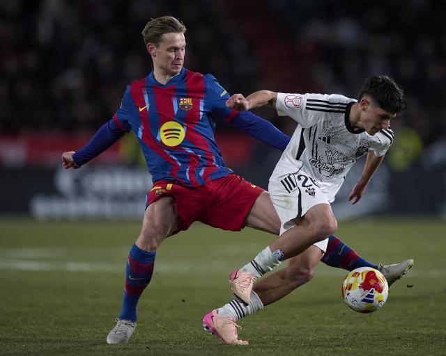 (260204) -- ALBACETE, Feb. 4, 2026 (Xinhua) -- Frenkie de Jong (L) of Barcelona vies with Capi of Albacete during the Copa del Rey quarterfinal match between Albacete and Barcelona in Albacete, Spain, Feb. 3, 2026. (Str/Xinhua)