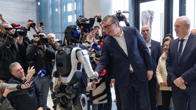 (260204) -- BEIJING, Feb. 4, 2026 (Xinhua) -- Serbian President Aleksandar Vucic shakes hands with a robot at the Chinese Cultural Center in Belgrade, Serbia, Feb. 2, 2026. (Photo by Wang Wei/Xinhua)