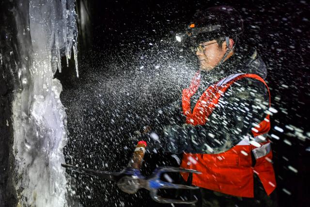 (260204) -- JINZHONG, Feb. 4, 2026 (Xinhua) -- A technician breaks ice in a railway tunnel in north China's Shanxi Province, Feb. 3, 2026.
  A team of maintenance technicians, most born in the 2000s, has spent the winter months shoveling and removing ice from railway tunnels deep in the mountainous terrain in Shanxi province to safeguard passengers' trips.
  Embarking on the patrol journey at dawn, they trek more than nine kilometers every day to clear ice in seven railway tunnels. The arduous chipping, shoveling and transporting of large ice chucks means the technicians are totally burned out after a day of work.
  During the Chinese New Year, the team will stay on duty to ensure the safe operation of train services. Through their efforts, thousands more who have been working far from their hometowns for almost a year will be able to ride the train and return home safe and sound. (Xinhua/Cao Yang)