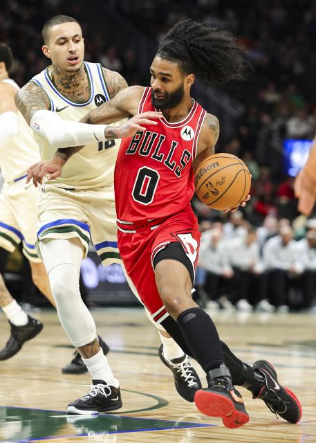 (260204) -- MILWAUKEE, Feb. 4, 2026 (Xinhua) -- Chicago Bulls' Coby White (R) drives the ball during the 2025-2026 NBA regular season basketball game between Milwaukee Bucks and Chicago Bulls in Milwaukee, the United States, on Feb. 3, 2026. (Photo by Joel Lerner/Xinhua)